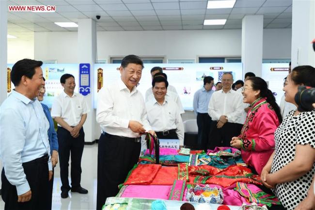 Chinese President Xi Jinping, also general secretary of the Communist Party of China (CPC) Central Committee and chairman of the Central Military Commission, visits a community at Songshan District in Chifeng City, China's Inner Mongolia Autonomous Region, July 15, 2019. [Photo: Xinhua/Xie Huanchi]