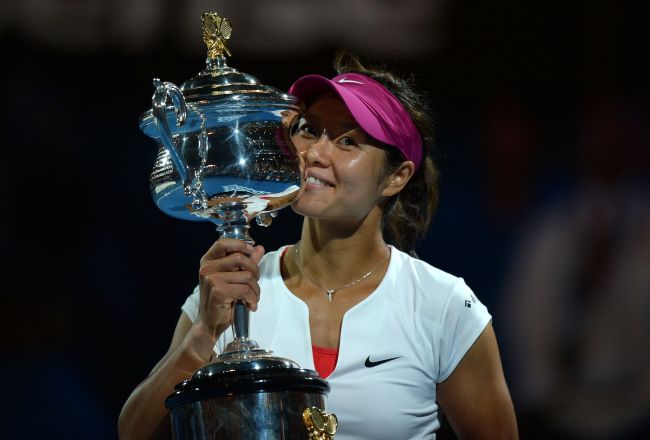 China's Li Na poses with the trophy after victory in her women's singles final match against Slovakia's Dominika Cibulkova on day thirteen of the 2014 Australian Open tennis tournament in Melbourne on January 25, 2014. [Photo: VCG]