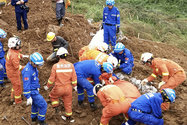 Firefighters and rescuers work at the landslide site in Shuicheng County of Liu Panshui City, Guizhou Province, July 24, 2019. [Photo: IC]