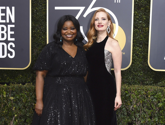 This Jan. 7, 2018 file photo shows Octavia Spencer, left, and Jessica Chastain at the 75th annual Golden Globe Awards in Beverly Hills, Calif. Spencer opened Chastain's eyes to pay disparity for women of color, the African-American actress said during a Sundance Film Festival panel last year. Chastain vowed to make things right on her film and the result, Spencer said, was an increase of five times in what she'd expected. [Photo: AP/Invision/Jordan Strauss]