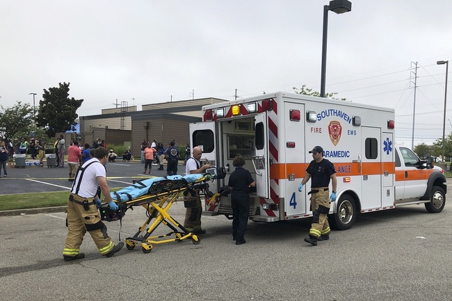 Medical staff stand outside a Walmart store, Tuesday, July 30, 2019, in Southaven, southeastern U.S. state of Mississippi. [Photo: IC]