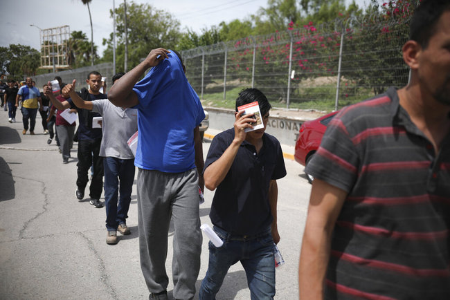 Migrants return to Mexico, using the Puerta Mexico bridge that crosses the Rio Grande river, in Matamoros, Mexico, Wednesday, July 31, 2019, on the border with Brownsville, Texas. [Photo: AP]