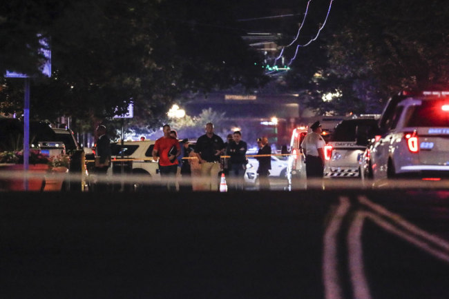 Authorities work at the scene of a mass shooting, Sunday, Aug. 4, 2019, in Dayton, Ohio. [Photo: AP via IC/John Minchillo]