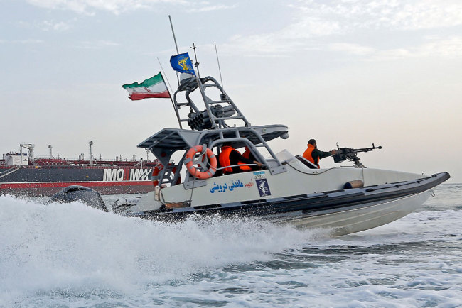 An Iranian Revolutionary Guard jet boat sails around a seized tanker in Bandar Abbas, southern Iran, on July 21, 2019. [File photo: EPA via IC/Hasan Shirvani]