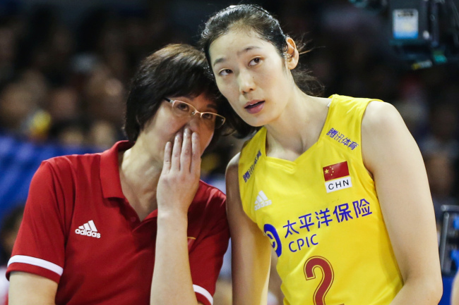 China's head coach Lang Ping speaks to player Zhu Ting during the match against Turkey on Sunday, August 4, 2019. [Photo: VCG]