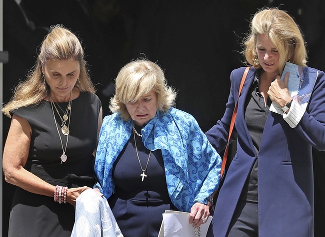 Courtney Kennedy Hill helped down the steps by by Maria Shriver, left, and Sydney Lawford McKelvy, right, at the funeral services for her daughter Saoirse Kennedy Hill at Our Lady of Victory Church in Centerville, Mass., Monday, Aug. 5, 2019. [Photo: AP]