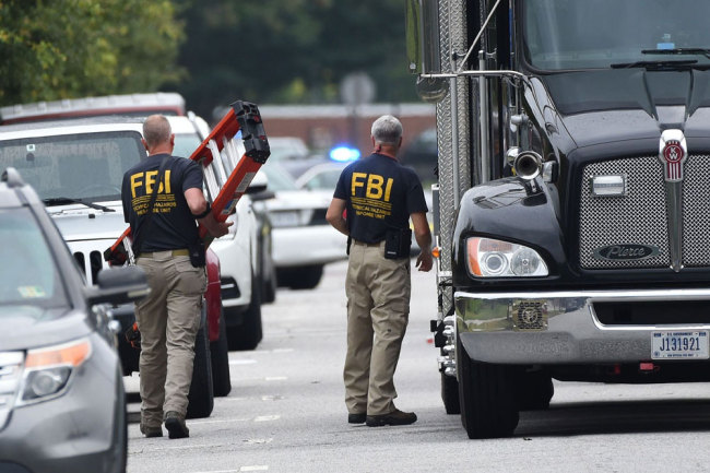 FBI agents work on June 1, 2019, at the scene of the mass shooting in the Virginia Beach Municipal center. [File photo: AFP via VCG/Eric Baradat]