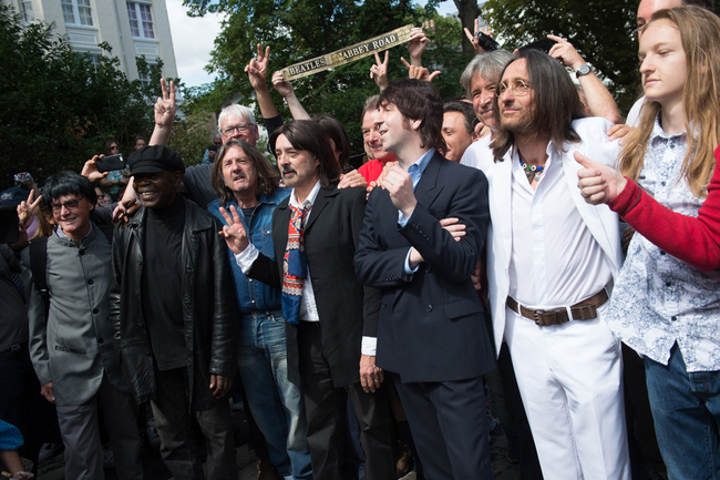 Beatles Lookalike band 'Fab Gear' pose on the famous Abbey Road crossing outside Abbey Road Studios, London, England on Thursday August 8, 2019 to mark the 50th Anniversary of the day the photograph was taken for the album cover. [Photo: IC]