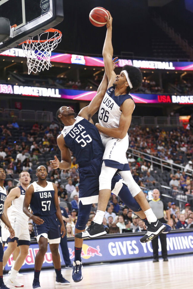 Team White forward Jarrett Allen (36) goes up for a dunk against Team Blue forward Thaddeus Young (55) during the first half of the U.S. men's basketball team's scrimmage in Las Vegas, Friday, Aug. 9, 2019. [Photo: AP]