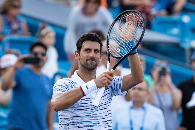 Novak Djokovic (SRB) applauds the crowd after winning his match at Tuesday's round of the Western and Southern Open at the Lindner Family Tennis Center, August 13, 2019. [Photo: ZUMA via IC/Scott Stuart]