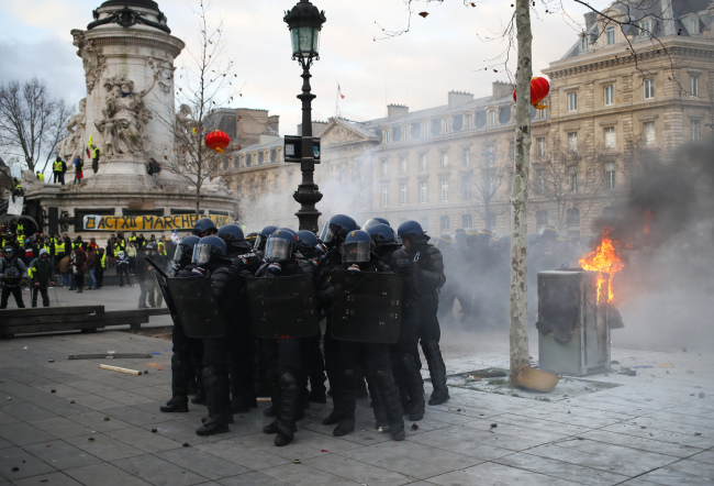 In this Saturday, Feb. 2, 2019 file photo riot police officers take position on the Place de la Republique during a yellow vest protest in Paris. [Photo: AP]
