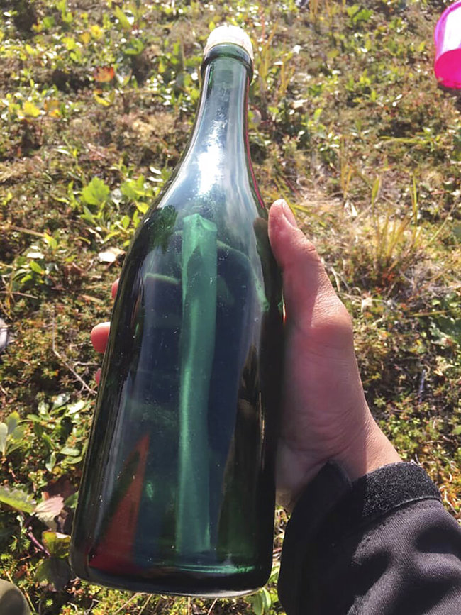 This undated photo provided by Tyler Ivanoff shows a bottle with a message that he found on the shores of western Alaska. [Photo: AP]