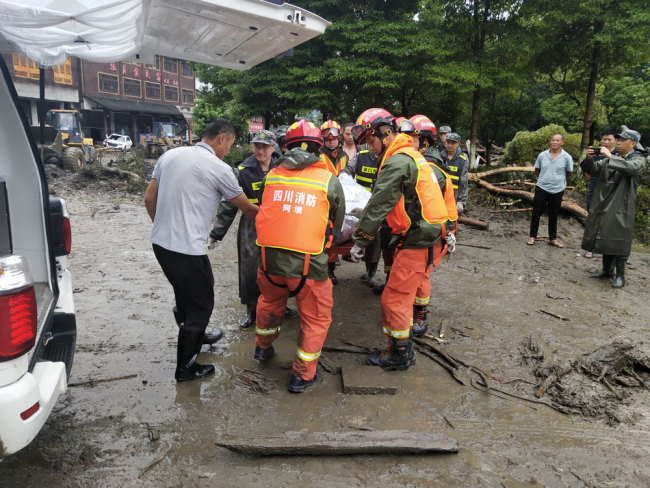 Rescuers work on site after multiple mudslides hit Aba Tibetan and Qiang Autonomous Prefecture, Sichuan Province. [Photo: IC]