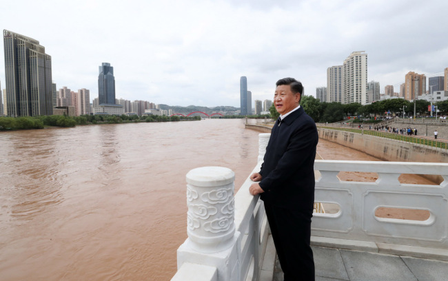 Chinese President Xi Jinping, also general secretary of the Communist Party of China Central Committee and chairman of the Central Military Commission, visits a Yellow River management point to learn about the management, protection and flood control project construction of the Yellow River in Lanzhou, Gansu Province, Aug. 21, 2019. [Photo: Xinhua/Ju Peng]
