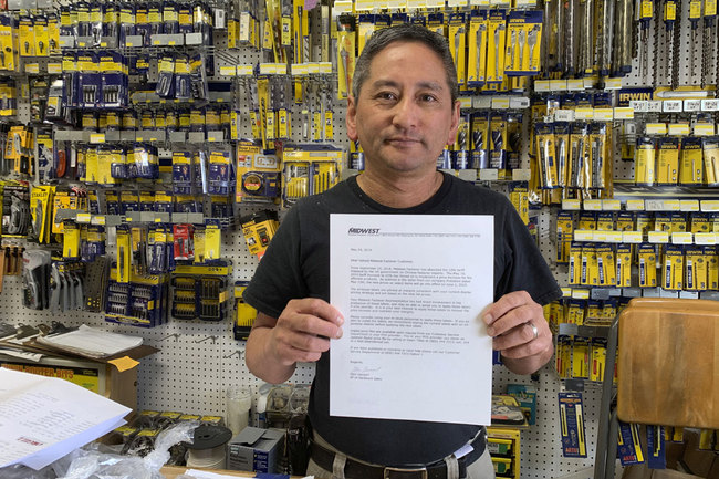 In this photo taken Wednesday, Aug. 28, 2019, Albert Chow, owner of Great Wall Hardware in San Francisco, holds a May 2019 letter from a supplier notifying him that prices will be increasing 10 to 18 percent because of US tariffs on Chinese goods. [Photo: AP/Terry Chea]