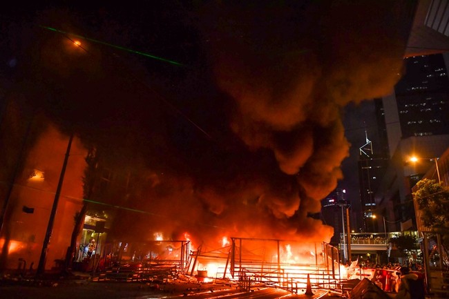 Smoke billows from a barricade that protesters set on fire in the Wan Chai district in Hong Kong on August 31, 2019. [Photo: AFP/Lillian SUWANRUMPHA]