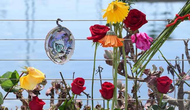 Flowers, candles, notes and artifacts are seen at a makeshift memorial for the victims of a scuba diving boat fire in Santa Barbara, California on September 3, 2019. [Photo: AFP]