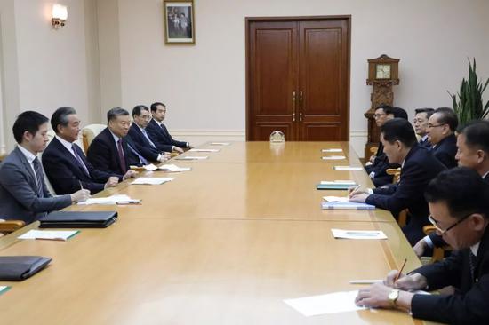 Visiting Chinese State Councilor and Foreign Minister Wang Yi talks with Ri Su Yong, member of the Political Bureau and vice-chairman of the Central Committee of the Workers' Party of Korea (WPK) of the DPRK, on September 4, 2019. [Photo: fmprc.gov.cn]