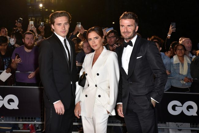 Brooklyn Beckham, Victoria Beckham and David Beckham arriving at the GQ Men of the Year Awards 2019 in association with Hugo Boss at the Tate Modern on September 3, 2019 in London, England. [Photo: IC]
