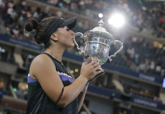 Bianca Andreescu of Canada celebrates with the championship trophy after defeating Serena Williams of the US during the women's final match on the thirteenth day of the US Open Tennis Championships the USTA National Tennis Center in Flushing Meadows, New York, USA, September 07, 2019. [Photo: EPA via IC/JUSTIN LANE]