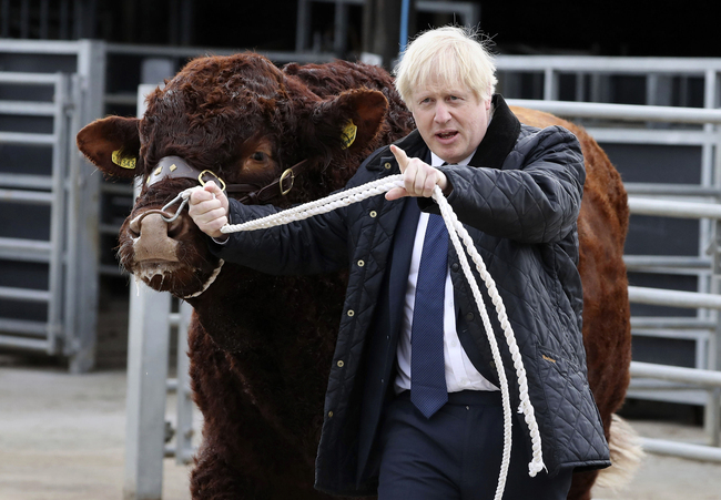 Britain's Prime Minister Boris Johnson visits Darnford Farm in Banchory near Aberdeen, Scotland, Friday Sept. 6, 2019, to coincide with the publication of Lord Bew's review and an announcement of extra funding for Scottish farmers. [Photo: Andrew Milligan/PA via AP]