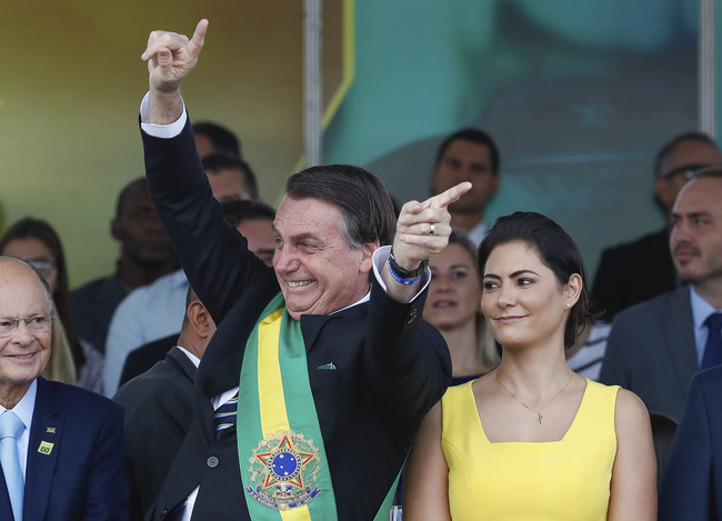 In this photo released by Brazil's Presidential press office, Brazil's President Jair Bolsonaro attends an Independence Day military parade accompanied by first lady Michelle Bolsonaro, in Brasilia, Brazil, Saturday, Sept. 7, 2019. Bolsonaro has overseen Brazil's independence day celebrations with a renewed assertion of his country's sovereignty over the Amazon. [Photo: Marcos Correa/Brazil's Presidential Press Office via AP]