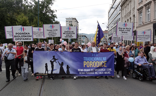 Holding banners and balloons, participants march in what they said was a gathering designed to promote traditional family values in Sarajevo, Bosnia, Saturday, Sept. 7, 2019. Several hundred people have marched in Bosnia's capital Sarajevo to express their disapproval of the Balkan country's first ever LGBT pride parade scheduled for Sunday. [Photo: AP/Eldar Emric]