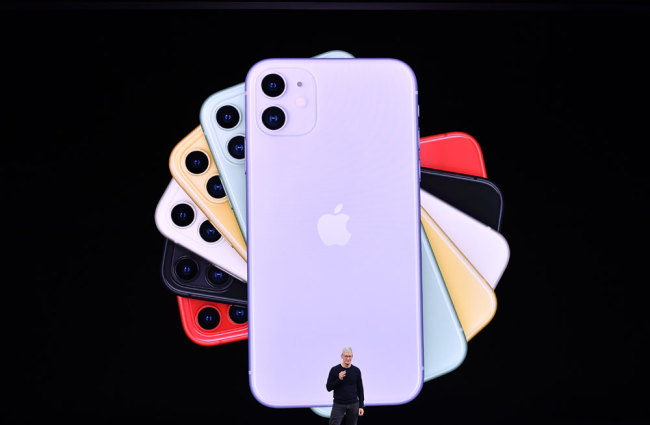 Apple CEO Tim Cook speaks on-stage during a product launch event at Apple's headquarters in Cupertino, California on September 10, 2019. Apple unveiled its iPhone 11 models Tuesday, touting upgraded, ultra-wide cameras as it updated its popular smartphone lineup and cut its entry price to $699. [Photo: AFP/Josh Edelson]
