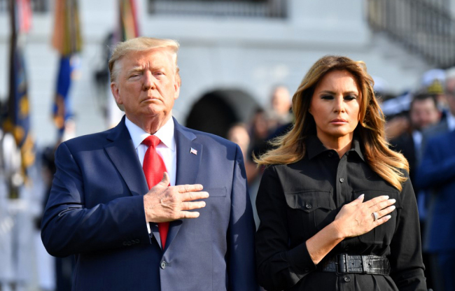 U.S. President Donald Trump and First Lady Melania Trump observe a moment of silence at the White House to mark the 18th anniversary of the 9/11 attacks on September 11, 2019, in Washington, DC. [Photo: AFP/Nicholas Kamm]