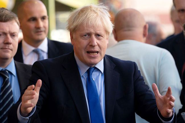 Britain's Prime Minister Boris Johnson reacts as he meets traders during his visit to Doncaster Market, in Doncaster, northern England, on September 13, 2019. [Photo: AFP/Jon Super]