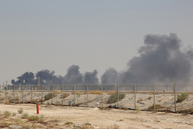 Smoke billows from an Aramco oil facility in Abqaiq about 60km (37 miles) southwest of Dhahran in Saudi Arabia's eastern province on September 14, 2019. [Photo: AFP]