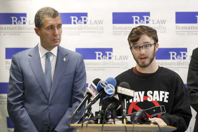 Adam Hergenreder, right, responds to a question as Attorney Antonio Romanucci, listens after Romanucci announced the filing of a civil lawsuit against e-cigarette maker Juul, on behalf of Hergenreder, during a news conference Friday, Sept. 13, 2019, in Chicago. [Photo: AP]