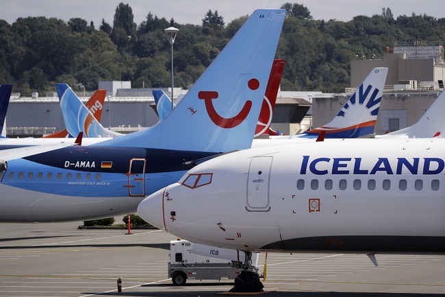 Dozens of grounded Boeing 737 MAX airplanes, including one for Icelandair, right, and TUI Airlines, center, crowd a parking area adjacent to Boeing Field Thursday, Aug. 15, 2019, in Seattle. [File Photo: AP via IC/Elaine Thompson]