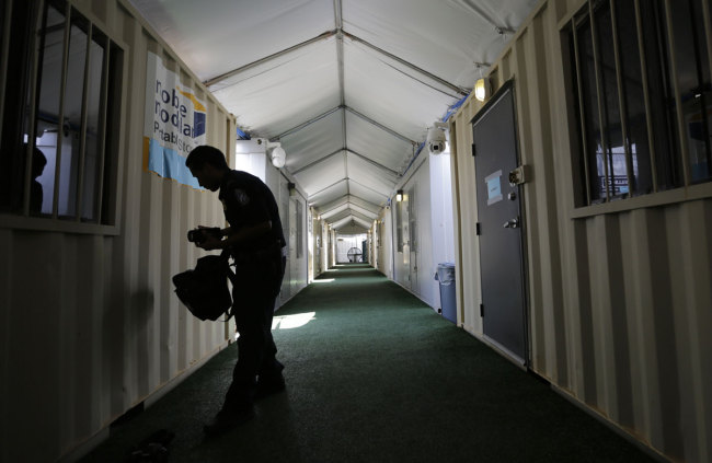 Pods are lined up and used as interview rooms at a new tent courtroom at the Migration Protection Protocols Immigration Hearing Facility, Tuesday, Sept. 17, 2019, in Laredo, Texas. [Photo: AP/Eric Gay]