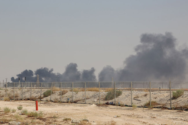 Smoke billows from an Aramco oil facility in Abqaiq about 60km (37 miles) southwest of Dhahran in Saudi Arabia's eastern province on September 14, 2019. [File photo: AFP]