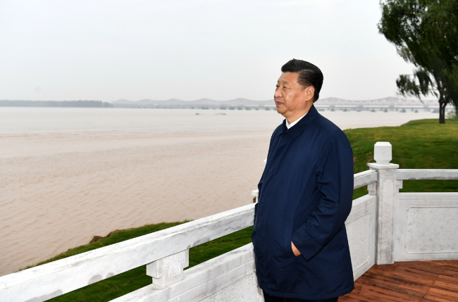 Chinese President Xi Jinping, also general secretary of the Communist Party of China Central Committee and chairman of the Central Military Commission, inspects ecological protection of the Yellow River at a national geopark during his tour in Zhengzhou, central China's Henan Province, Sept. 17, 2019. [Photo: Xinhua]