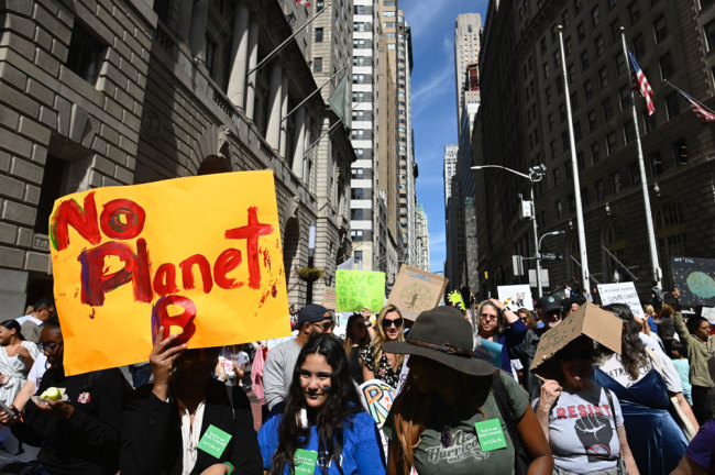 Students participate in the Global Climate Strike march on September 20, 2019 in New York City. [Photo: AFP/Johannes Eisele]