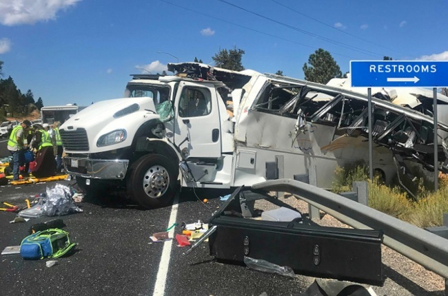This photo released by the Garfield County Sheriff's Office shows a tour bus that was carrying Chinese tourists after it crashed near Bryce Canyon National Park in southern Utah, killing at least four people and critically injuring up to 15 others, Friday, Sept. 20, 2019. [Photo: Garfield County Sheriff's Office via AP/Sheriff Danny Perkins]