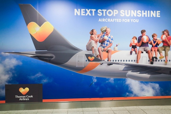 A large poster of Thomas Cook airlines at Gatwick Airport. [File Photo: SOPA Images via IC/Amer Ghazzal]