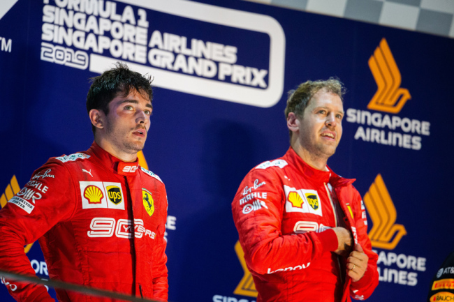 Charles Leclerc (Left) and Sebastian Vettel of Ferrari stand on the podium after the Formula One Singapore Grand Prix on Sep 22, 2019. [Photo: IC]