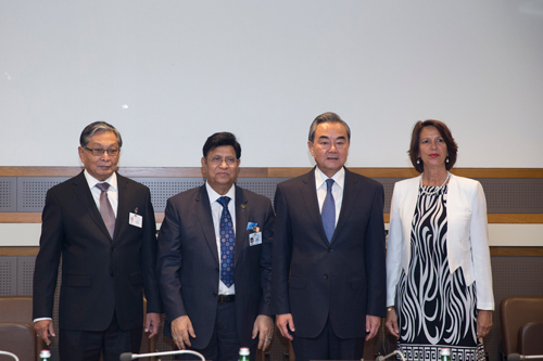 Chinese State Councilor and Foreign Minister Wang Yi poses for photos with Myanmar's Minister of the State Counselor's Office U Kyaw Tint Swe, Bangladeshi Foreign Minister AK Abdul Momen, and the UN Secretary-General's special envoy on Myanmar Christine Schraner Burgener at an informal trilateral meeting at the United Nations headquarters in New York on September 23, 2019. [Photo: fmprc.gov.cn]