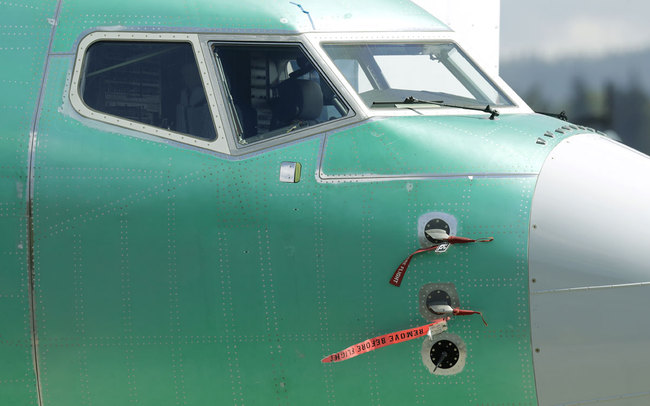 In this April 26, 2019, file photo caution flags are shown on flight sensors on a Boeing 737 MAX 8 airplane being built at Boeing's assembly facility in Renton, Wash. [Photo: AP]