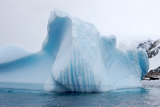 Iceberg with line markings and waterline erosion near cuverville island Antarctica. [File Photo: IC]