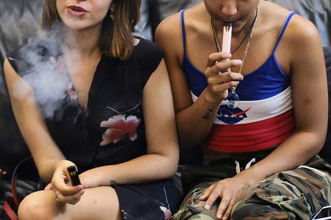 In this Saturday, June 8, 2019 file photo, two women smoke cannabis vape pens at a party in Los Angeles. [Photo: AP]