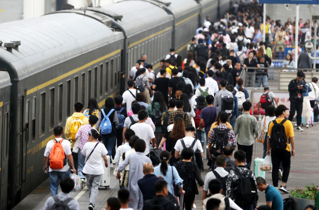 Passengers are seen at Nanjing Railway Station in Nanjing, Jiangsu Province, October 1, 2019. [Photo: IC]