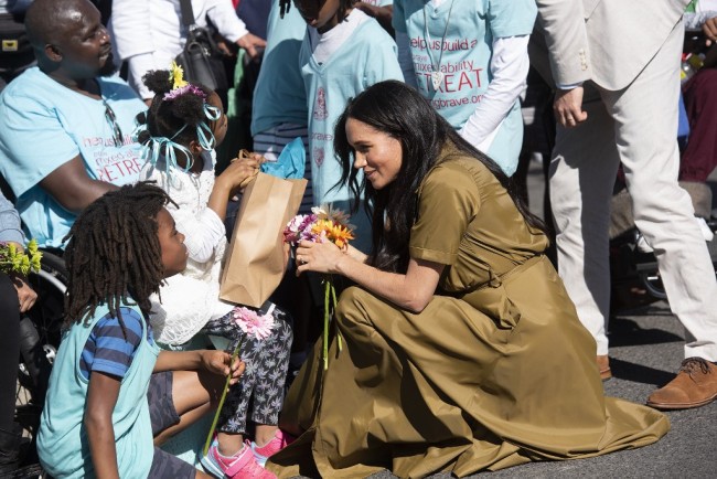 Meghan, Duchess of Sussex, meets supporters as she visits Cape Town's Bo Kaap district on September 24, 2019. [Photo: AFP/David Harrison]