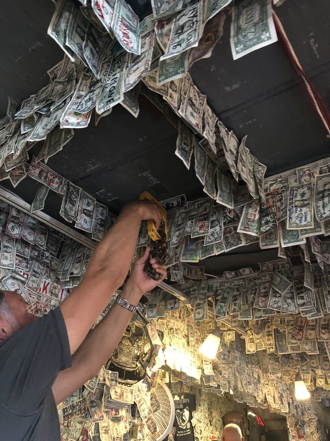 File photo: Dollar bills are taking down from the Siesta Key Oyster Bar. [Photo: @Coach_BenMcD]