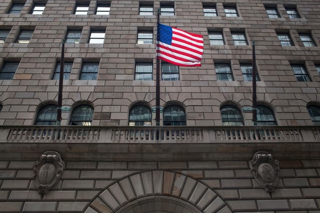 In this file photo taken on July 29, 2011, a US flag flies over the entrance to the Federal Reserve Bank of New York in New York City. [Photo: AFP]