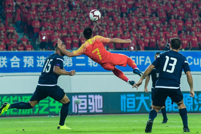 Wu Lei performs acrobatic overhead kick at a game between China and Guam during the Qatar 2022 World Cup Asian qualifiers, at the Tianhe Sports Center in Guangzhou, Guangdong Province, on Thursday, October 10, 2019. [Photo: IC]