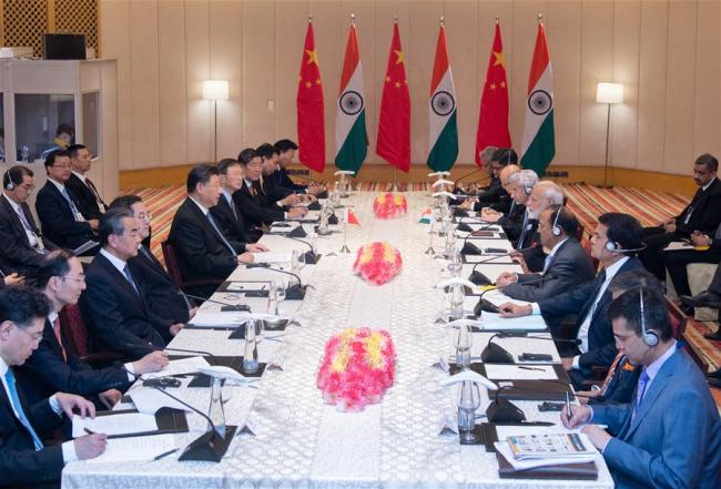 Chinese President Xi Jinping and Indian Prime Minister Narendra Modi continue their informal meeting in Chennai, India, Oct. 12, 2019. [Photo: Xinhua/Xie Huanchi]